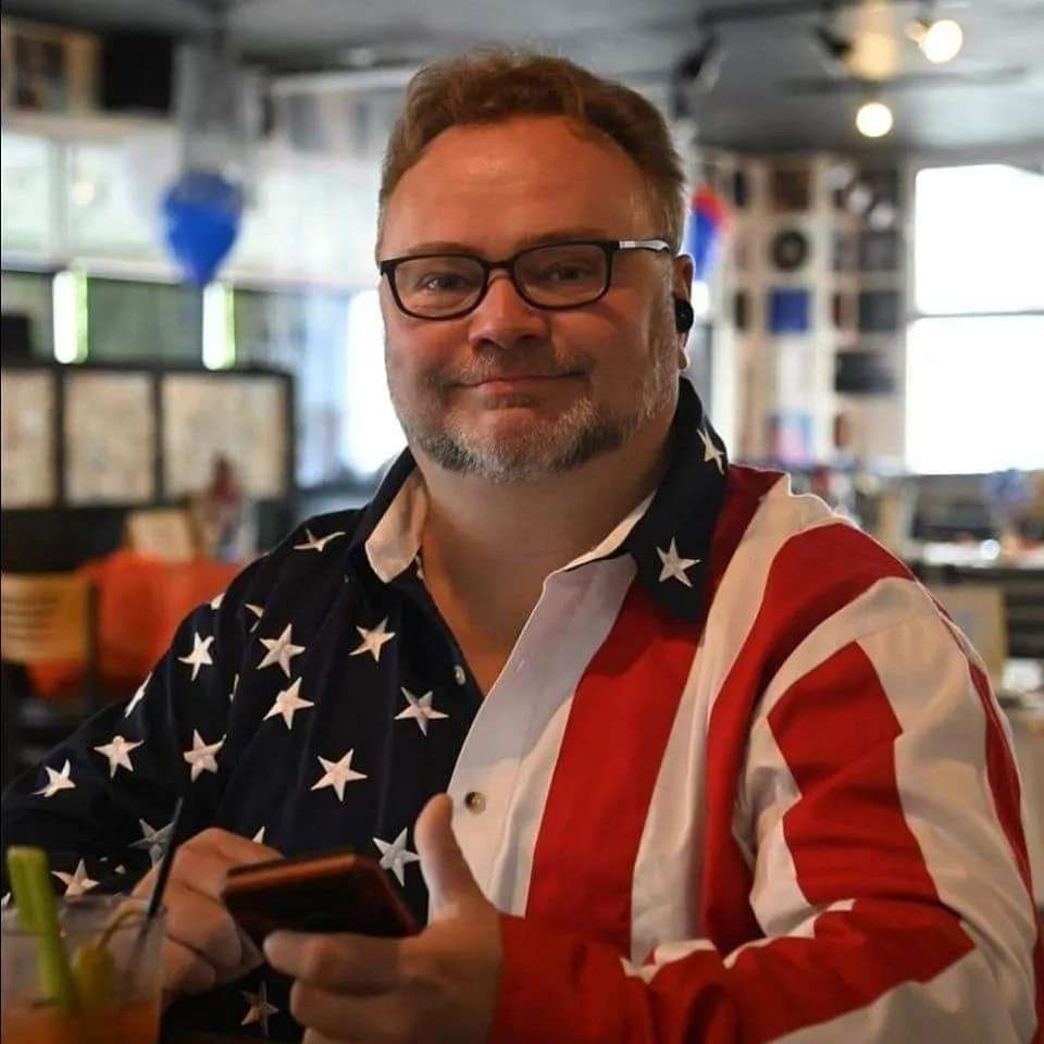 Doug Neiheisel smiling in a stars-and-stripes shirt